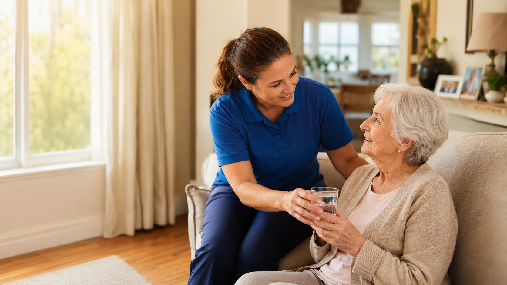 An attentive caregiver sharing a genuine, caring moment with an older woman in Tulsa
