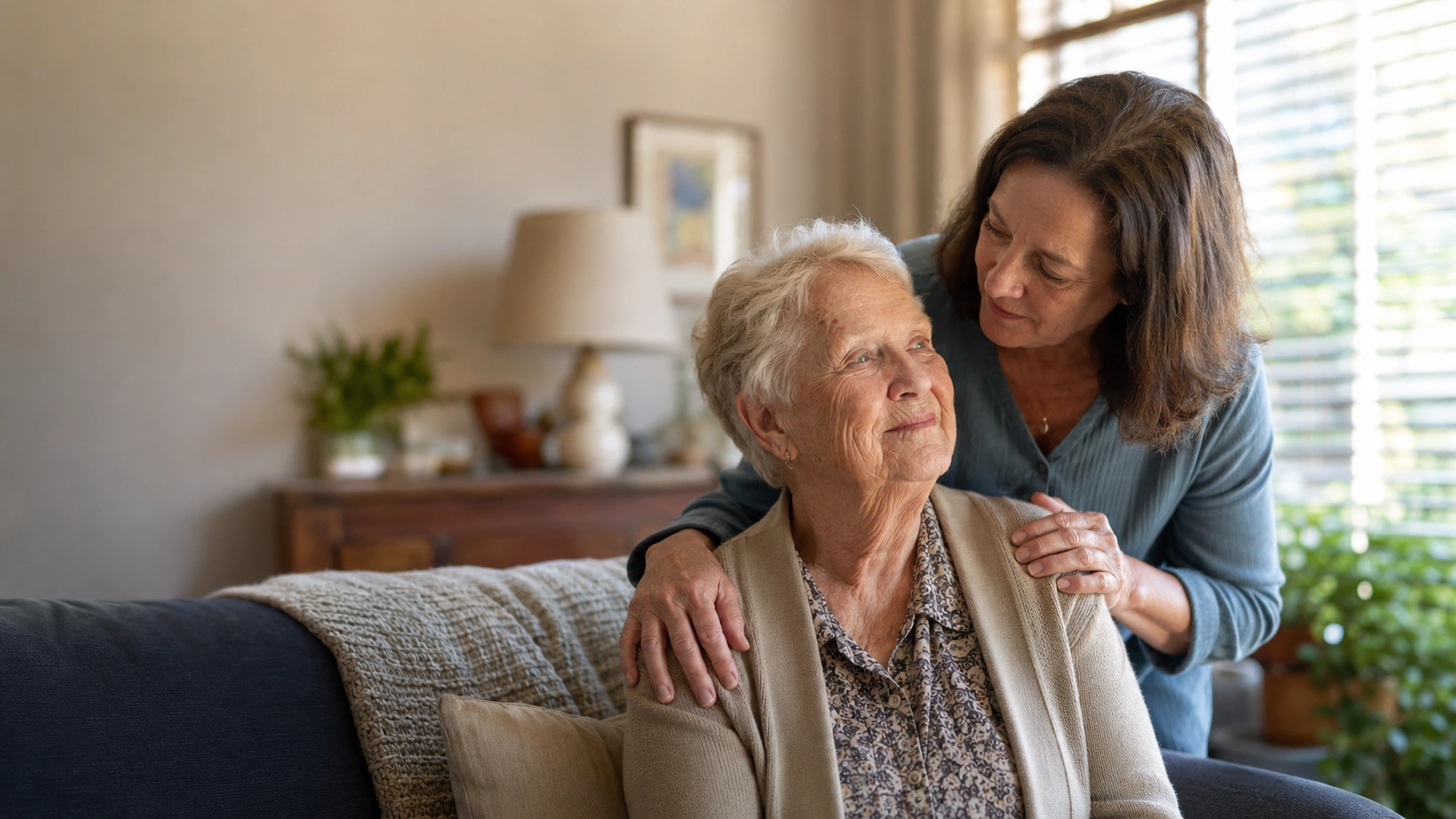 An adult child checking in thoughtfully on an older parent at home in Tulsa